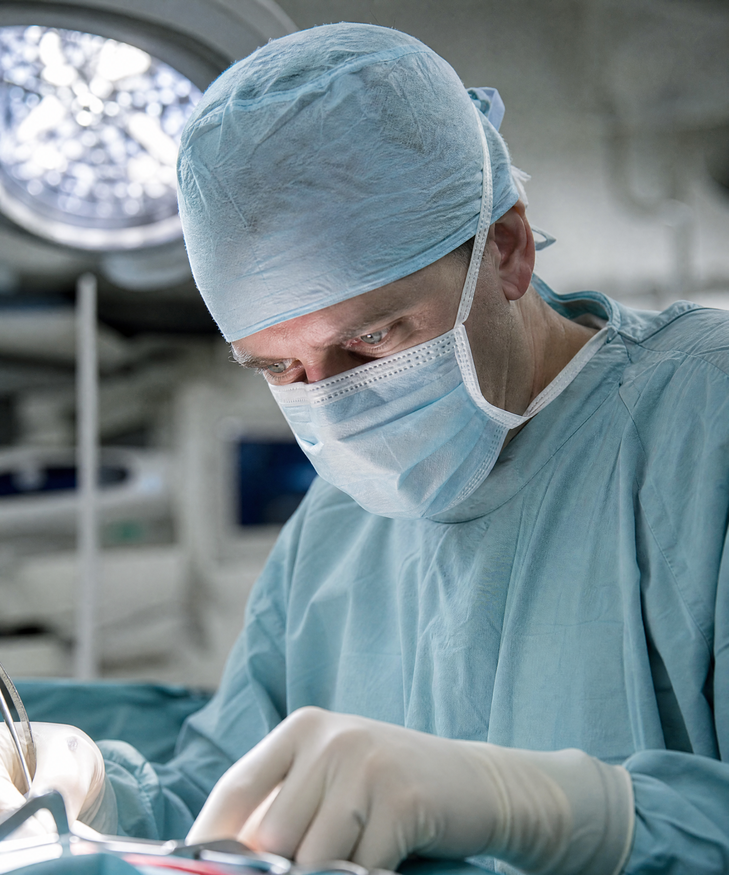 A surgeon at work in an operating theatre